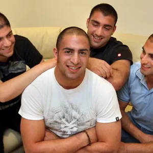 Image of 3 men supporting their mate