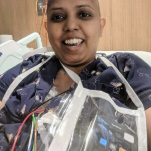 image of patient in hospital with an portable pump attached to deliver anti-cancer treatment